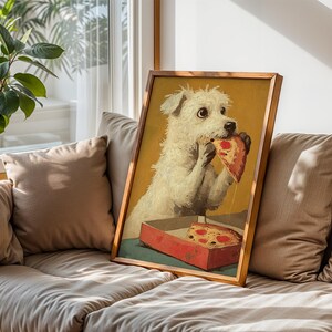 May include: A framed print shows a white dog enjoying a slice of pizza from a red box. The dog has a surprised expression, with pizza sauce dripping. The artwork is set against a yellow background.