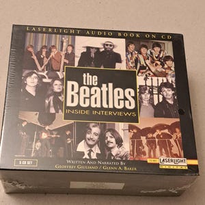 May include: A boxed set of "The Beatles Inside Interviews" on CD. The black box features images of the band members and the text "LASERLIGHT AUDIO BOOK ON CD". The set includes 5 CDs and is written and narrated by Geoffrey Giuliano and Glenn A. Baker.