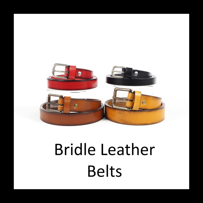 May include: Four leather belts in red, black, brown, and yellow, each with a silver or brass buckle. The belts are arranged in pairs, with the text "Bridle Leather Belts" below.