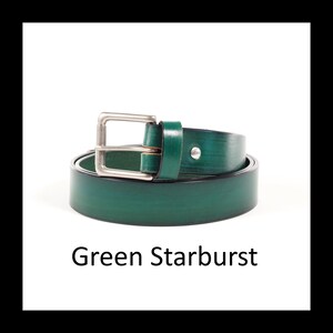 May include: A rolled-up, emerald green leather belt with a silver-colored buckle. The belt has a single silver-colored stud. The text "Green Starburst" is below the belt.