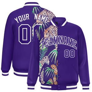 May include: A purple varsity jacket with white trim. The jacket has a leopard print and tropical foliage design on the front and back. The back has the text "YOUR" and a white number "0". The front has the text "TEAMNAME" and the number "00".