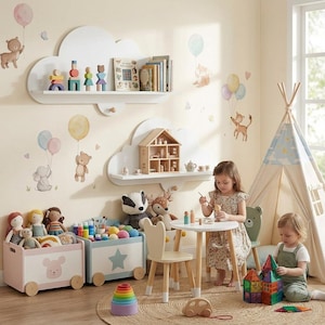 May include: A nursery room featuring two white cloud-shaped wall shelves holding wooden toys and books, two rolling toy storage bins with bear and star motifs, a small round table with two chairs, a play tent, and various plush toys and blocks.