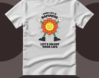 May include: A white short-sleeved t-shirt featuring a graphic of a smiling orange flower with arms and legs. The text above the flower reads GOOD LIFE IS HAPINESS and the text below reads LET'S ENJOY YOUR LIFE. The design includes black outlines.