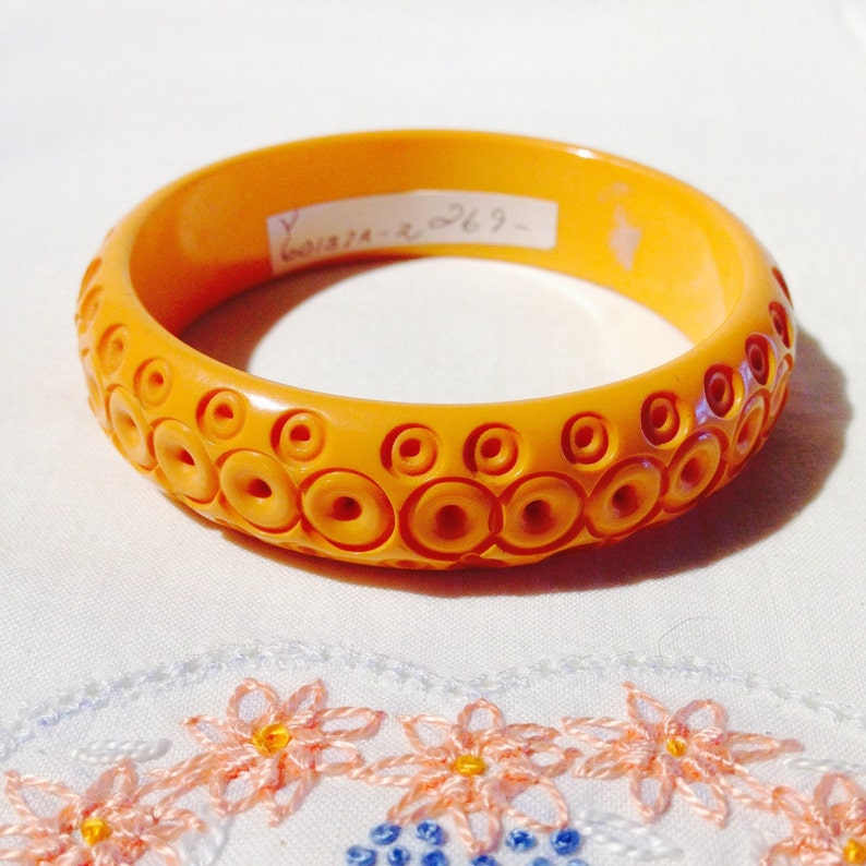 Bakelite Bangle Yellow Carved Circles image 1