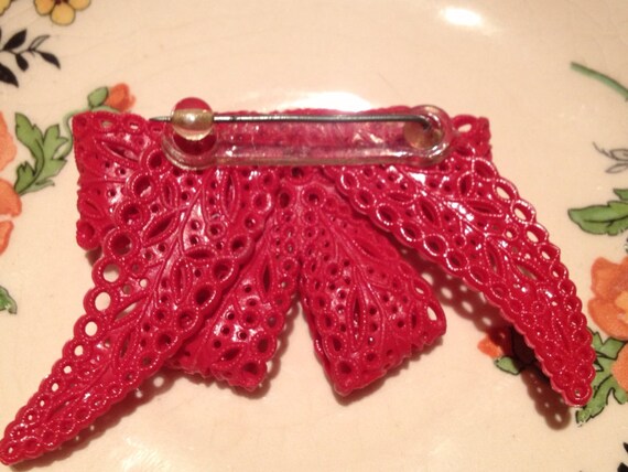 Brooch Celluloid molded 1930s red bow - image 2
