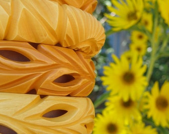 1 Yellow Carved Pierced Bakelite Bangle (Center photo)