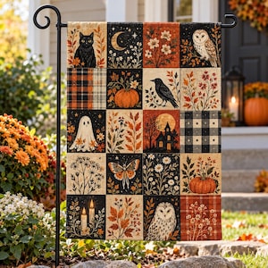 May include: A rectangular garden flag featuring a patchwork grid of autumn-themed illustrations including a black cat, crescent moon, owl, pumpkin, crow, ghost, haunted house, butterfly, candles, and fall foliage in shades of orange, black, and white.