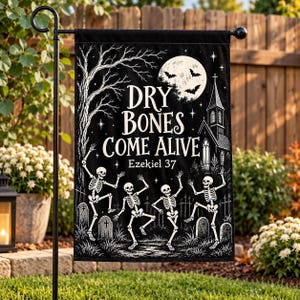 May include: A black garden flag featuring a white illustration of four dancing skeletons in a graveyard. The text reads DRY BONES COME ALIVE and Ezekiel 37. The design includes a full moon, bats, a bare tree, and a church silhouette against a dark sky.