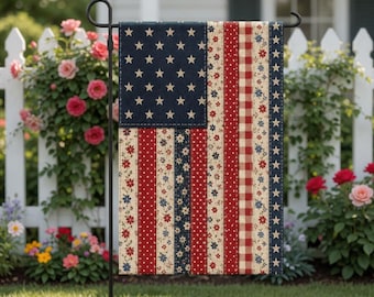 May include: A decorative garden flag featuring a patchwork design resembling the American flag. The flag has a navy blue field with white stars, and red and white striped sections with floral and polka dot patterns. The flag is displayed on a black metal stand.
