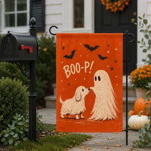 May include: A rectangular orange garden flag featuring a white illustration of a small dog and a ghost touching noses. The text BOO-P! is printed in white above the figures, surrounded by black bat silhouettes and small white star accents.