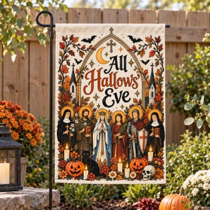 May include: A rectangular garden flag featuring the text All Hallows' Eve in a gothic archway. The design includes six figures in religious attire, a black cat, two jack-o'-lanterns, a skull, candles, and autumn leaves in orange and brown tones.
