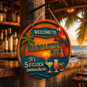 May include: A round wooden sign hanging from a rope, featuring a sunset beach scene with a palm tree, a colorful parrot, and three cocktails. The text reads: Welcome to Margarita's Bar, It's 5 o'clock somewhere. The sign has orange, blue, and green tones.