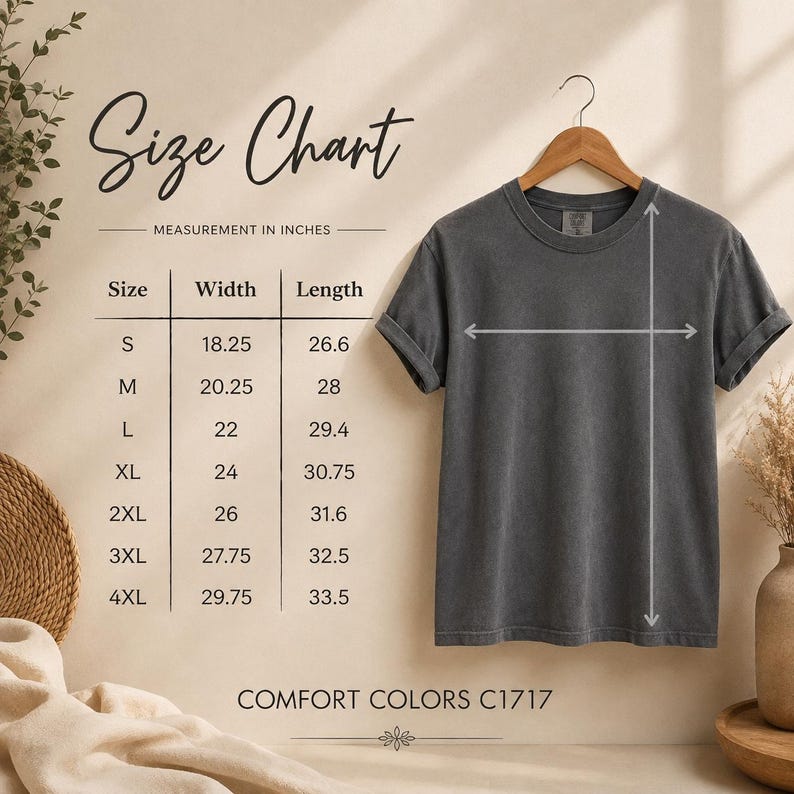 May include: A charcoal grey short-sleeve t-shirt hanging on a wooden hanger, accompanied by a size chart with measurements in inches. The chart lists sizes S through 4XL with corresponding width and length dimensions. Text reads Comfort Colors C1717.