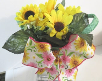 Sunflowers In A Basket With A Big Colorful Bow