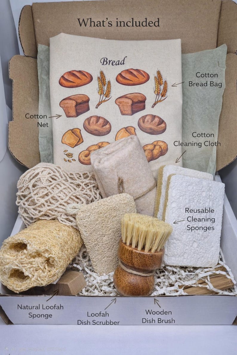 May include: A kitchen cleaning kit in a cardboard box containing a cotton bread bag with bread illustrations, a cotton net, a cotton cleaning cloth, reusable cleaning sponges, a natural loofah sponge, a loofah dish scrubber, and a wooden dish brush.