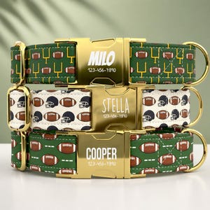 May include: Three pet collars with gold-tone metal buckles. The top collar is green with footballs and goalposts, engraved with MILO and 123-456-7890. The middle is white with footballs and helmets, engraved with STELLA and 123-456-7890. The bottom is green with footballs, engraved with COOPER and 123-456-7890.