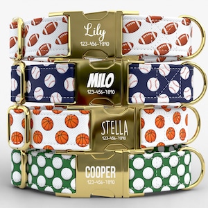 May include: Four personalized dog collars with gold-colored buckles. Each collar features a different sports theme: footballs, baseballs, basketballs, and golf balls. The buckles are engraved with a name and phone number.