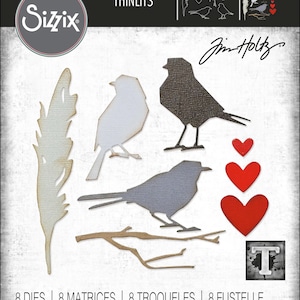 May include: Sizzix Thinlits Tim Holtz 666566 metal cutting die set featuring eight shapes: a feather, two birds, three red hearts, and two branches. The packaging displays the brand name, product number, and the count of eight dies in text.