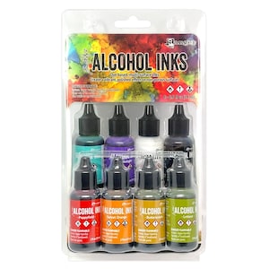 May include: A package of Ranger Alcohol Inks in various colors, including red, orange, and green. The package contains eight 0.5 fl oz (14 ml) bottles of dye-based, multi-surface inks. The label reads "Alcohol Inks" and "DANGER FLAMMABLE."