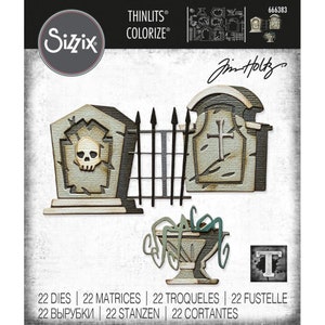May include: Sizzix Thinlits Colorize die set featuring Halloween-themed designs. Includes tombstone and skull motifs, a decorative urn, and a letter "T" design. The set includes 22 dies and matrices for crafting projects.