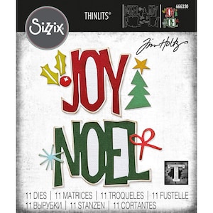 May include: A Sizzix Thinlits die set featuring the words "JOY" and "NOEL" in red and green, with festive embellishments like a star, Christmas tree, and holly. The set includes 11 dies for paper crafting projects.