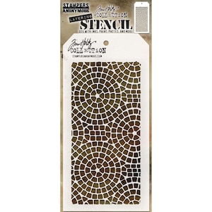 May include: A white stencil with a brown and white geometric pattern. The stencil is labeled "Stampers Anonymous Collection Layering Stencil" and "Gin Holley Collection".