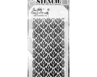May include: A black and white stencil with a repeating pattern of stylised leaves. The stencil is labelled "Jim Holtz Collection Layering Stencil" and "Stampers Anonymous".