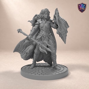 May include: A gray resin tabletop miniature of a warrior figure wearing scale armor and a flowing cape. The figure holds a trident-like staff in one hand and a large seashell-shaped shield in the other, standing on a circular cobblestone base.