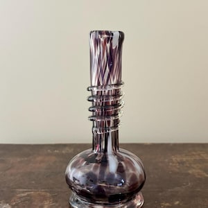 May include: A rustic wooden sign with the text "Welcome to our home" in white lettering. The sign has a distressed finish and a simple, inviting design, suitable for a front porch or entryway.