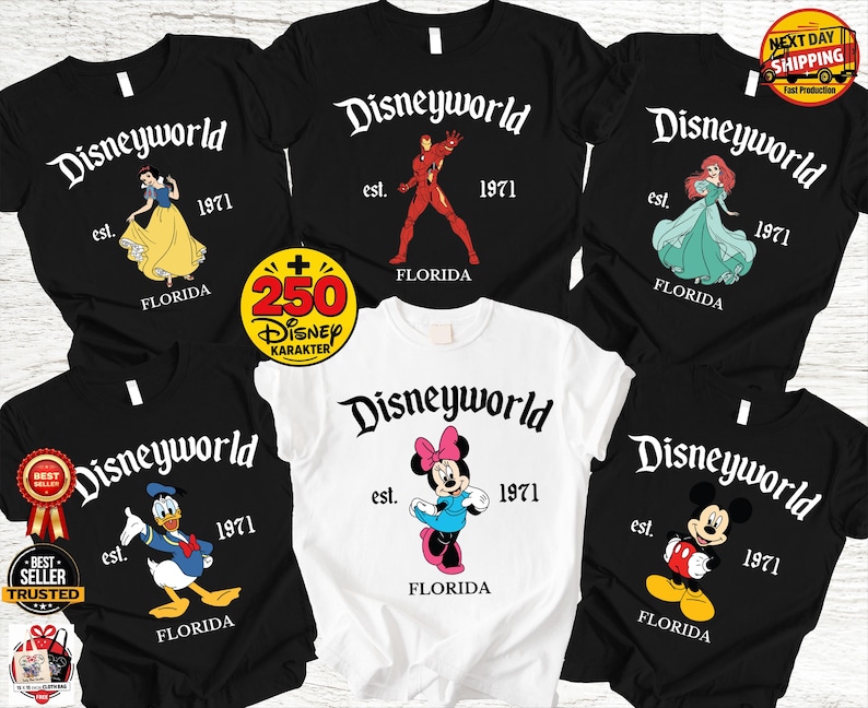 Op de afbeelding: Collectie zwarte en witte t-shirts met Disney-personages en de tekst "Disneyworld est. 1971 Florida." Personages zijn onder meer Sneeuwwitje, Iron Man, Ariel, Donald Duck, Minnie Mouse en Mickey Mouse.