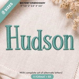 May include: Teal embroidery of the name Hudson in a serif font on light beige fabric. Text includes BX FONT EMBROIDERY 6 SIZES 1 inch, 1.5 inches, 2 inches, 2.5 inches, 3 inches, 3.5 inches, and With complete set of alternate letters! 11 FORMAT + BX.
