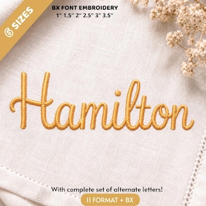 May include: Gold-colored embroidery of the name Hamilton in a cursive script on a white fabric background. Text above reads: BX FONT EMBROIDERY 6 SIZES 1" 1.5" 2" 2.5" 3" 3.5". Text below reads: With complete set of alternate letters! 11 FORMAT + BX.