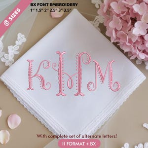 May include: White handkerchief with pink embroidered initials KHM. The handkerchief has a delicate lace trim and the text "BX FONT EMBROIDERY" with sizes from 1" to 3.5". The text "With complete set of alternate letters!" is also visible.
