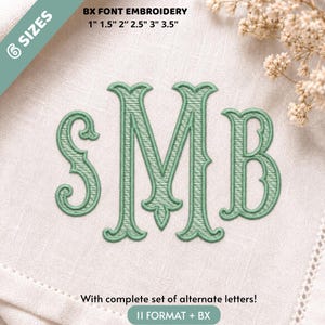 May include: A light green embroidered monogram featuring the letters S, M, and B in a decorative serif font. The text BX FONT EMBROIDERY 1" 1.5" 2" 2.5" 3" 3.5" and With complete set of alternate letters! 11 FORMAT + BX is visible on the fabric.