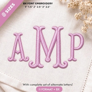 May include: Light purple embroidered letters AMP on white fabric. Text reads: 8 SIZES, BX FONT EMBROIDERY, 1" 1.5" 2" 2.5" 3" 3.5", With complete set of alternate letters!, 11 FORMAT + BX. The embroidery features a serif font with curved ends.