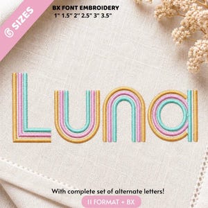 Puede incluir: Un diseño de bordado del nombre LUNA en una fuente estilo arcoíris con hilos dorados, rosas y turquesas. El texto incluye 6 tamaños de 2,54 cm a 8,89 cm, bordado de fuente BX y un conjunto completo de letras alternativas en 11 formatos.