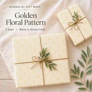 Floral wrapping paper pattern in soft golden tones with delicate hand-drawn flowers and airy dotted details on a warm ivory background