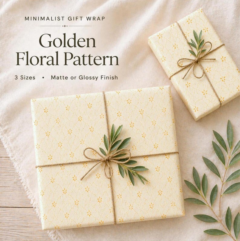 Floral wrapping paper pattern in soft golden tones with delicate hand-drawn flowers and airy dotted details on a warm ivory background