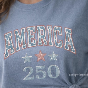 close up of vintage america 250 graphic tee, soft worn in print on comfort colors shirt