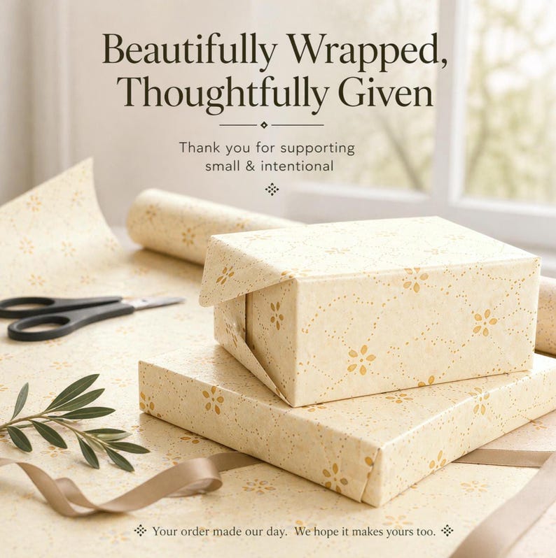 Golden floral gift wrap styled for a wrapped present, perfect for birthdays, thoughtful gifts, and gifts for her
