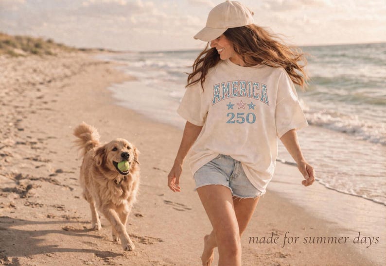 woman wearing casual patriotic shirt on beach, summer outfit america tee relaxed vintage style