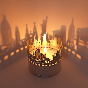 New York Skyline Shadow Play - Transformez les bougies chauffe-plat en superbes souvenirs avec des silhouettes emblématiques de la ville - Cadeau parfait pour les fans de New York !