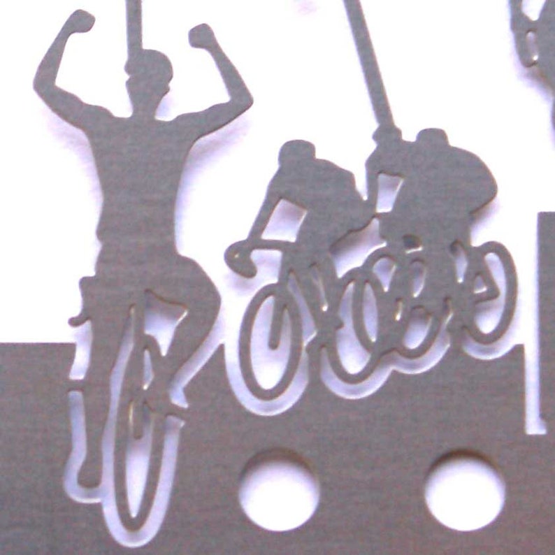 May include: Silhouette of three people riding bicycles. The person in the front is raising their arms in victory. The image is cut out of gray paper.
