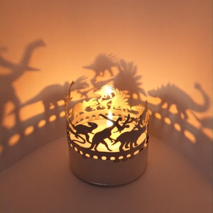 Dinosaur Shadow Play: Stunning Candle Attachment for Magical Room Decor and Mesmerizing Motifs - Perfect Gift for Dinosaur Enthusiasts!