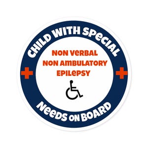 May include: A circular sticker with a dark blue border and white center. The text reads CHILD WITH SPECIAL NEEDS ON BOARD in white. The center features orange text stating NON VERBAL, NON AMBULATORY, EPILEPSY, and a black wheelchair icon.