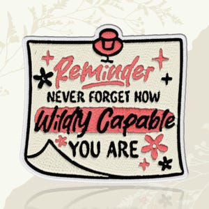 May include: Embroidered patch with the words "Reminder Never Forget How Wildly Capable You Are." The patch has a cream background with red and black text and accents. The patch is bordered with a white stitch.