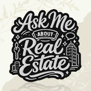May include: Black and white embroidered patch with the text "Ask Me About Real Estate". The patch features illustrations of a key, buildings, and a speech bubble. The design is surrounded by a black border.