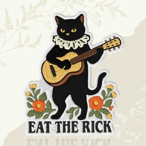 May include: Embroidered patch featuring a black cat playing a guitar, wearing a white ruffled collar. The patch includes the text "EAT THE RICH" in black letters, surrounded by orange and yellow flowers with green leaves.
