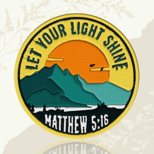 May include: Embroidered patch with a yellow border and the text "LET YOUR LIGHT SHINE". The patch features a mountain landscape with an orange sun, teal mountains, and the text "MATTHEW 5:16" in white.