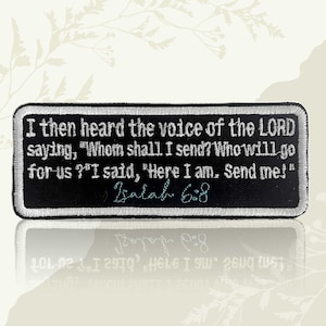 May include: Black rectangular patch with white embroidered text. The text reads, "I then heard the voice of the LORD saying, 'Whom shall I send? Who will go for us?' I said, 'Here I am. Send me!'" Isaiah 6:8 is also embroidered.